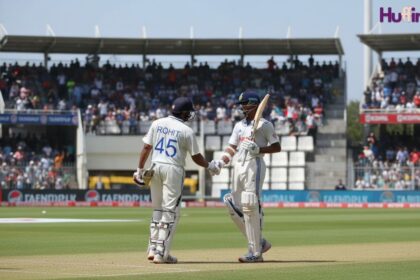 Indian Test batsmen celebrating partnership with handshake